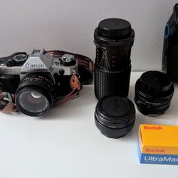 Canon AE-1 with Accessories And Original Manual 