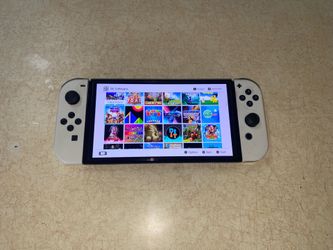 NINTENDO SWITCH OLED + 125 SWITCH GAMES