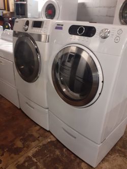 SAMSUNG front load washer and electric dryer with pedestals in excellent conditions