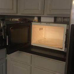 Panasonic silver microwave purchased three years ago ; 24in W X 13 L