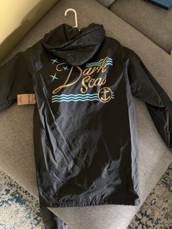 Brand new medium Dark Seas rain coat