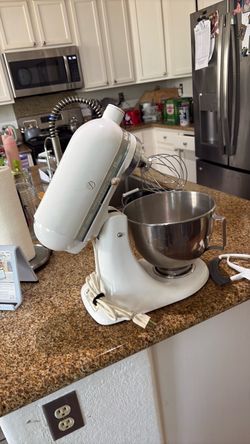 Kitchen aid classic plus mixer with extra attachment works perfect excellent condition.