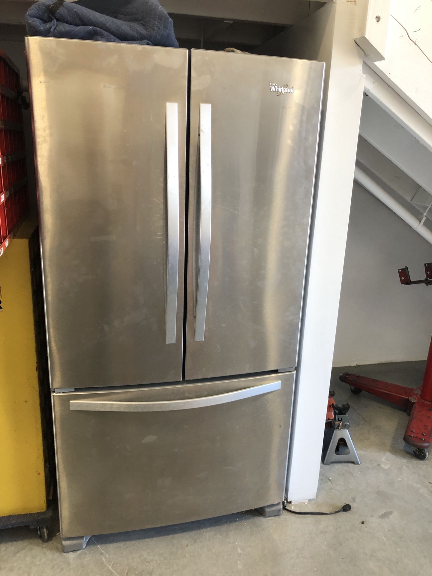 Whirlpool fridge. Used very little in a business. Large freezer, side by side doors