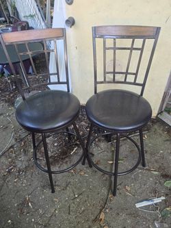 Two beautiful swivel bar stools