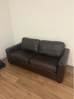 Brown leather Luxury pull out couch (heavily discounted)