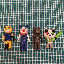 action figures from the popular Roblox game Piggy