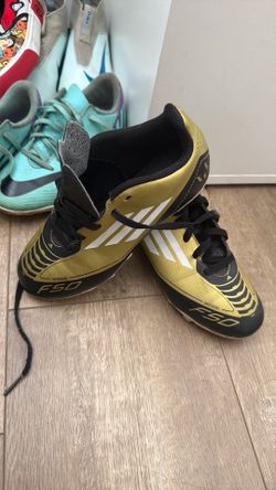 Messi F50 gold and black cleats size 1