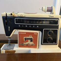 Singer sewing machine Diana  inside storage table manual And some accessories included. 