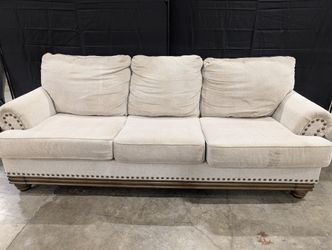Neutral Three-Cushion Nail Trim Sofa