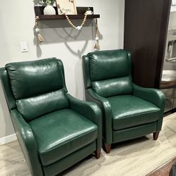 2 green leather sofas