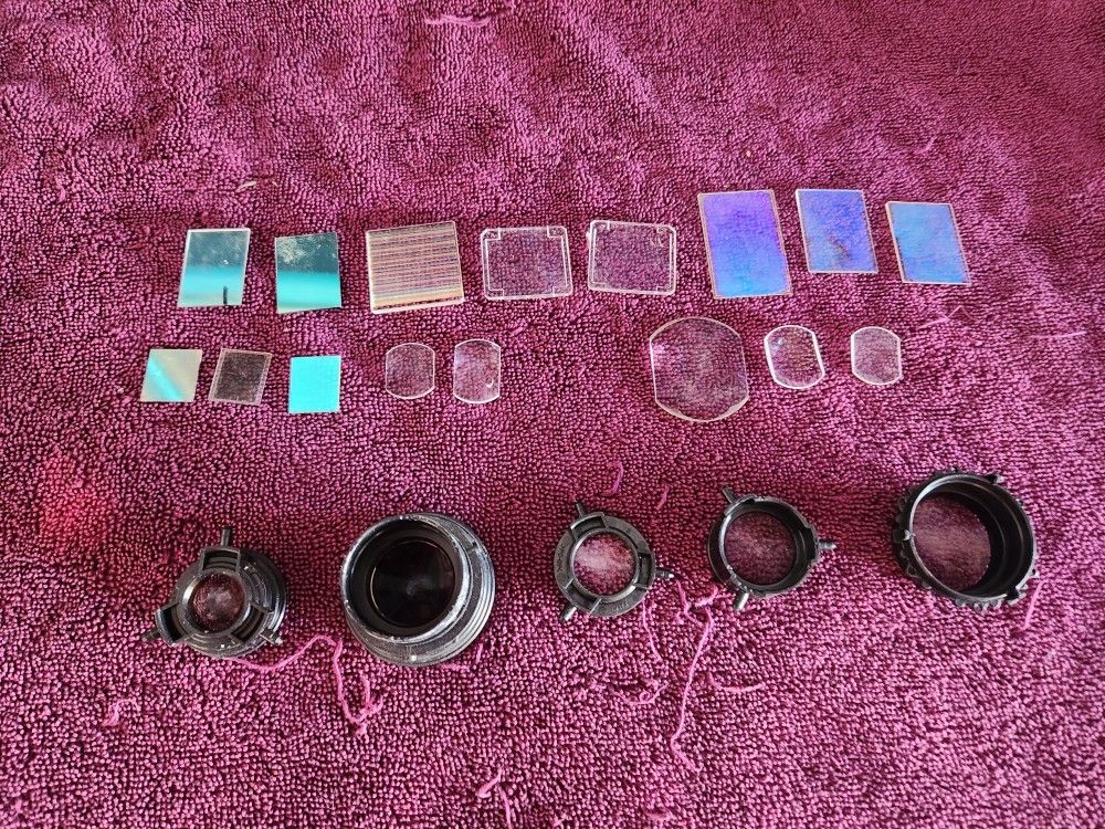 A collection of telescope parts, lenses and filters