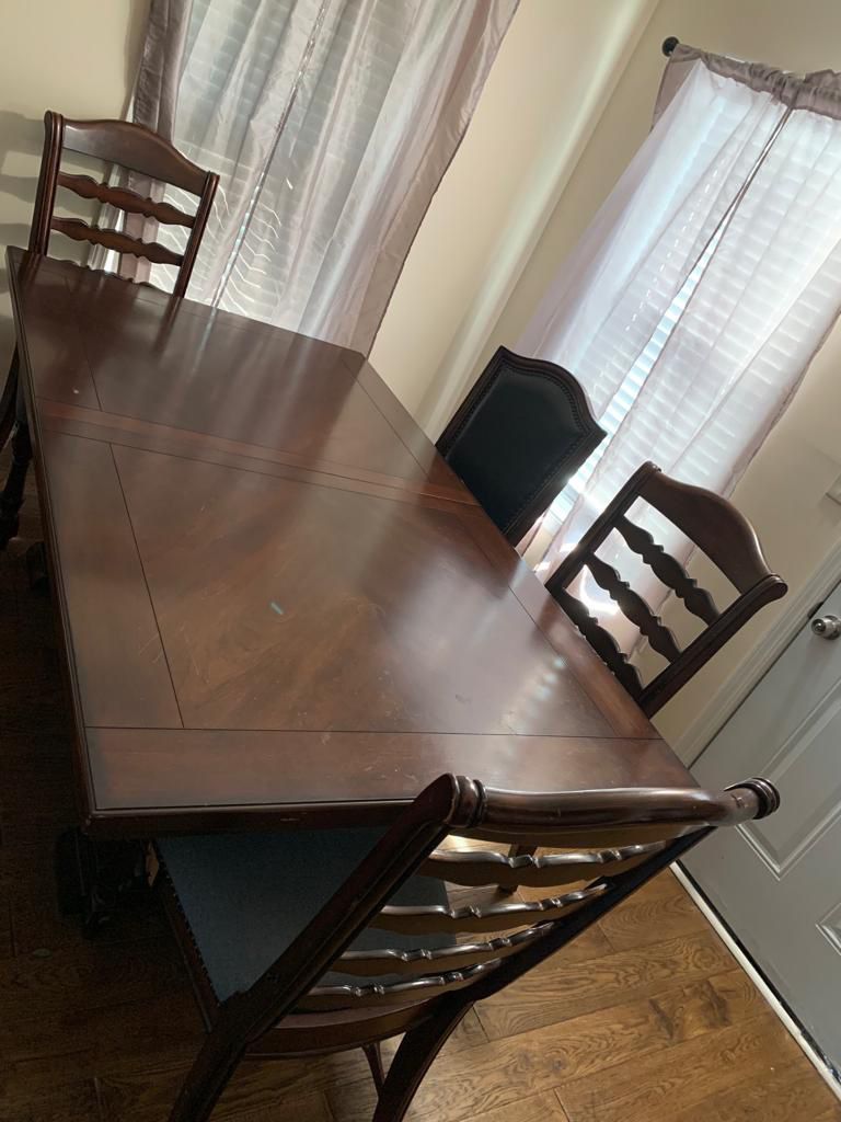 A dining room set with four chairs and China. Great conditions, Must Sell Quickly. Just let me know if you are interested