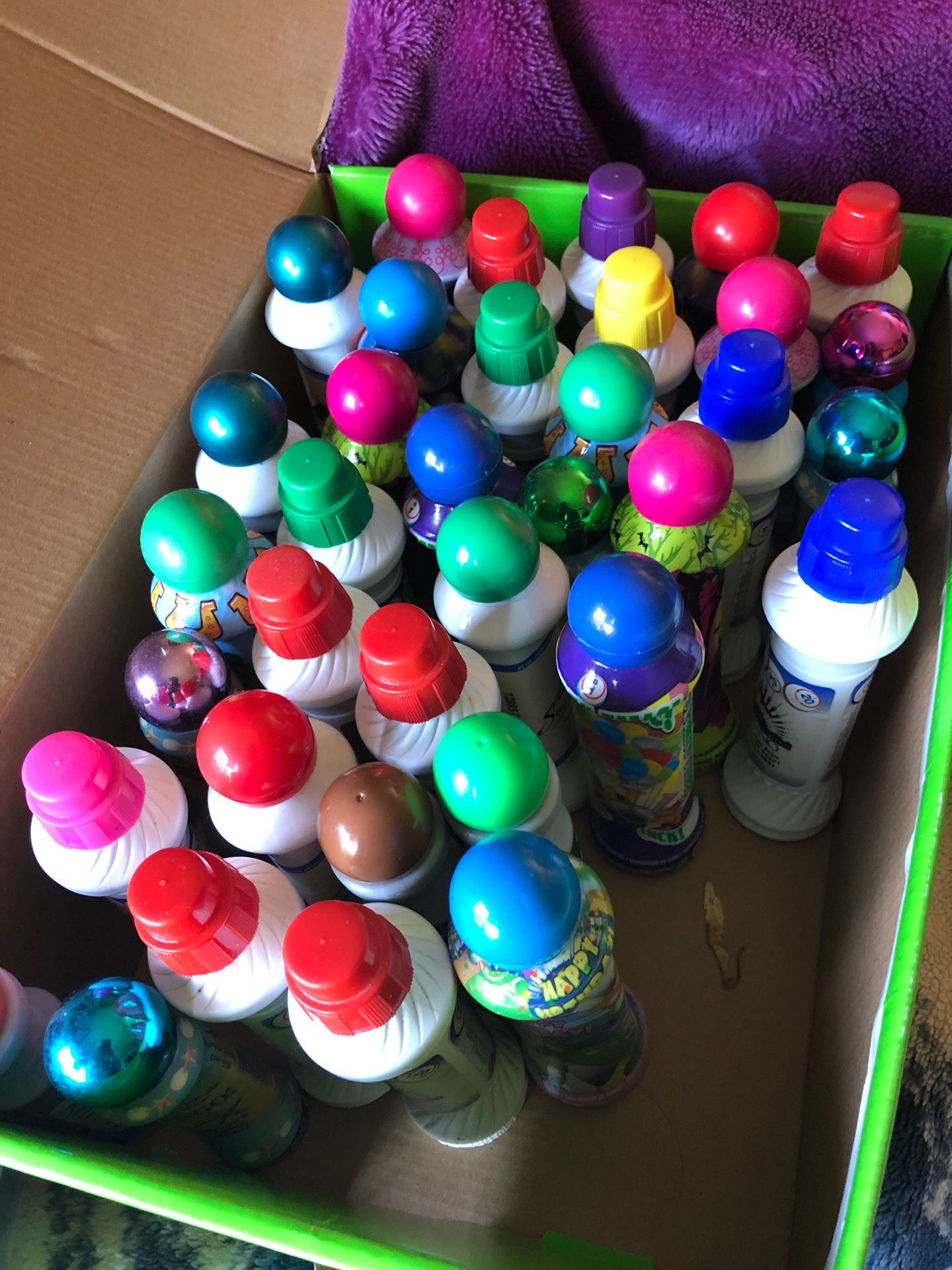 Lots of bingo paint bottles most of them are full about 37 bottles