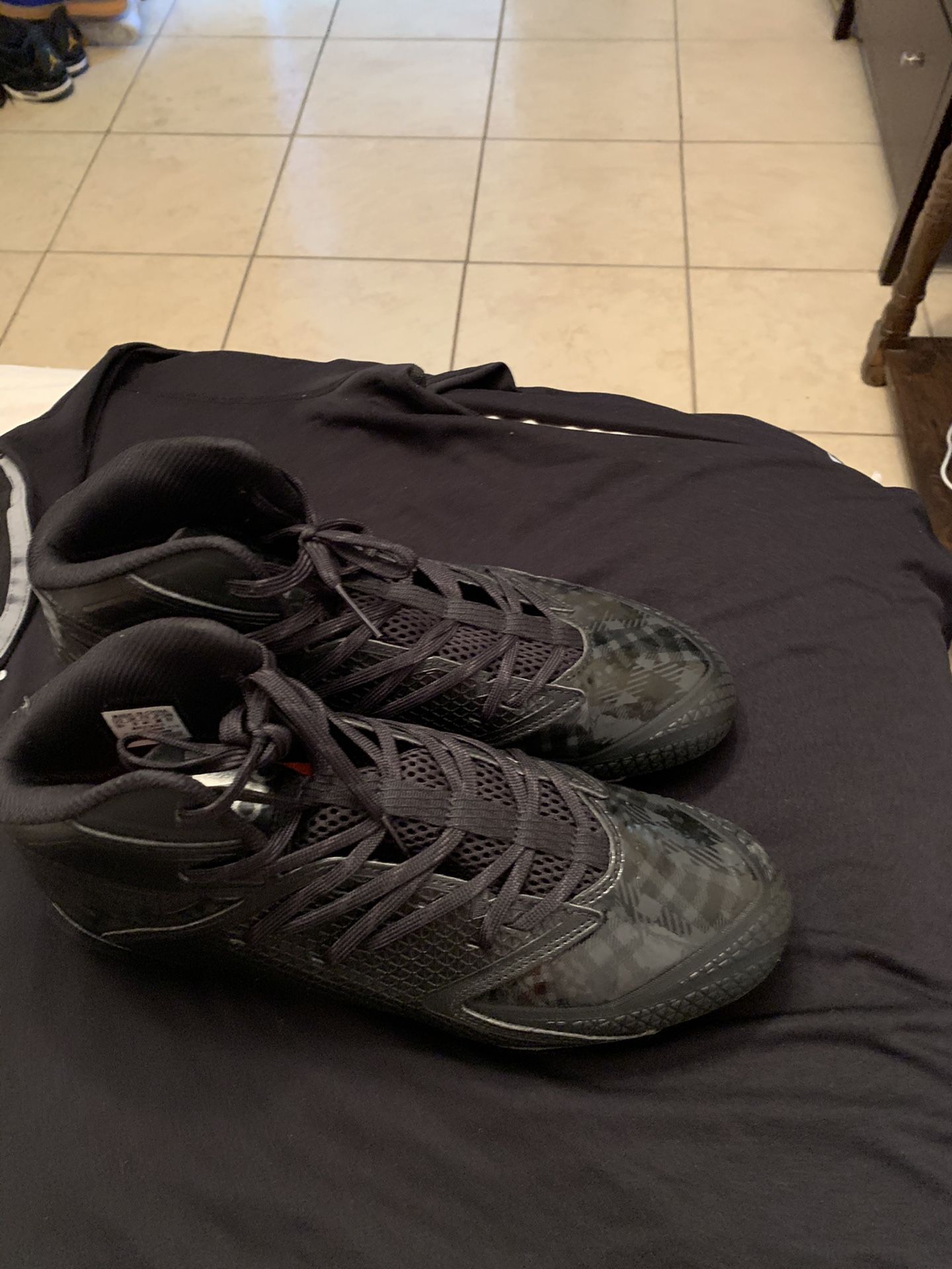 Adidas football or baseball cleats