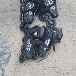 2 Pair Of Adjustable Inline Skates 