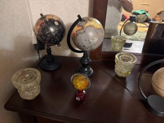 several stylish wooden heavy globes