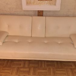 White faux leather futon