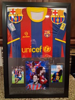 RONALDINHO GAUCHO OF THE BARCELONA SOCCER TEAM, BRANDED,AUTHENTIC FRAMED JERSEY.