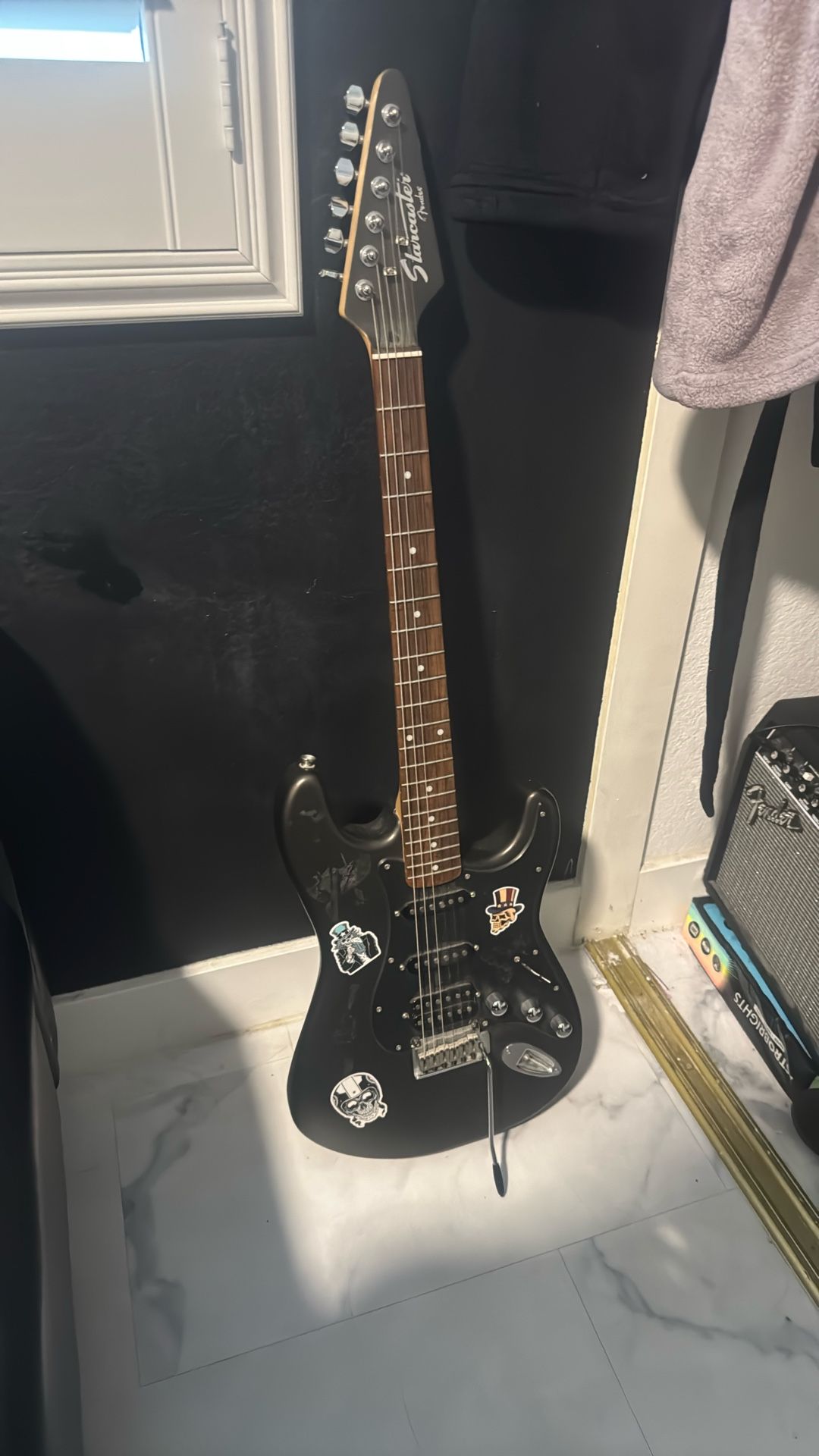 black fender guitar