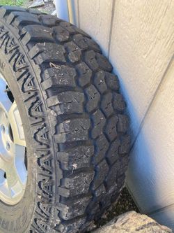 Stock Chevy Rims With 2 New Tires 