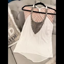 XOXO white racer back style white chiffon tank top with silver toned beading size Large with adjustable straps and elastic in back and split edge. Has