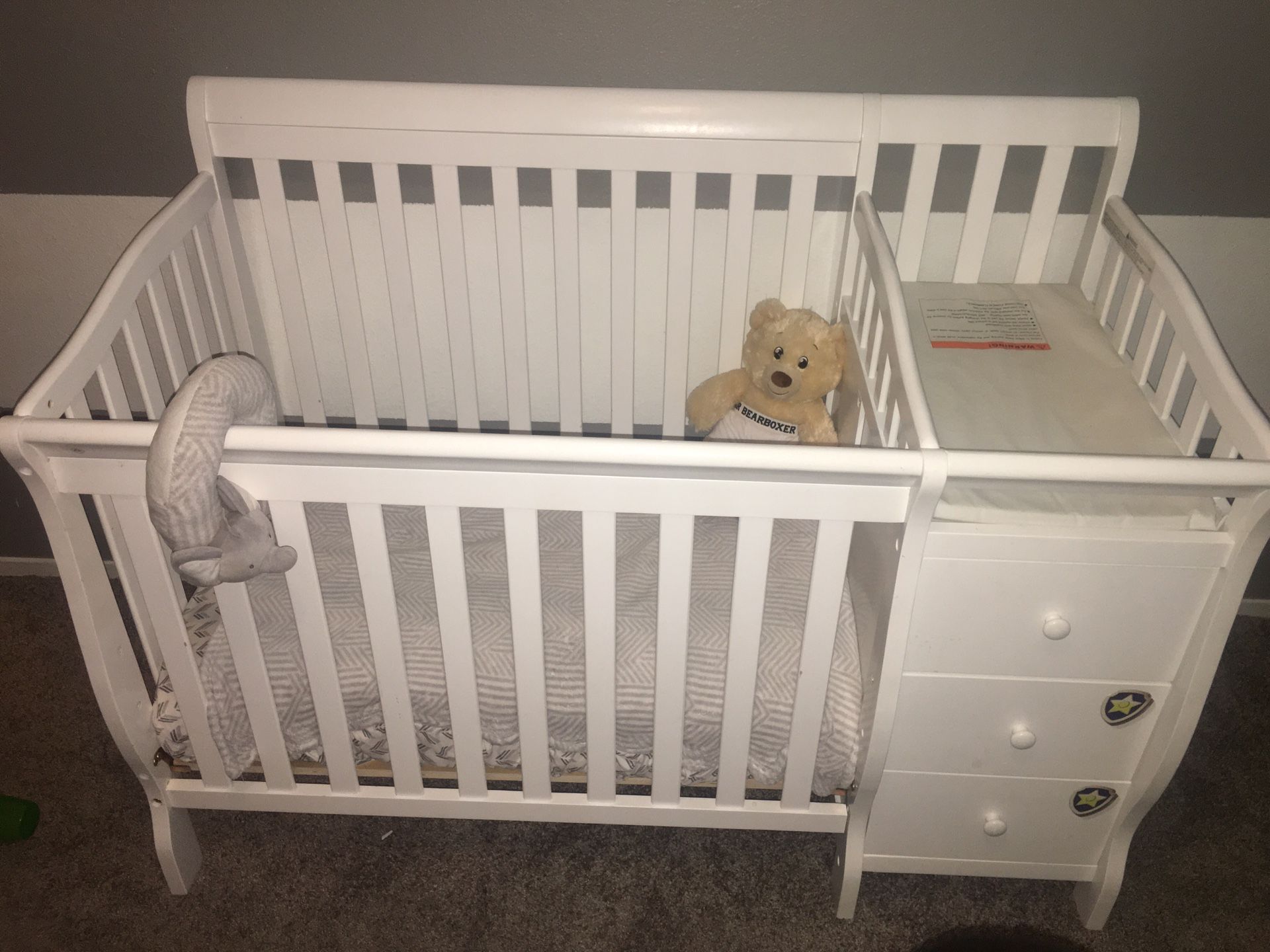 White crib with changing table