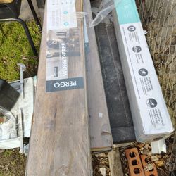 3 Cartons Of Pergo Laminated Flooring & 1 Thomasville Walnut Hardwood