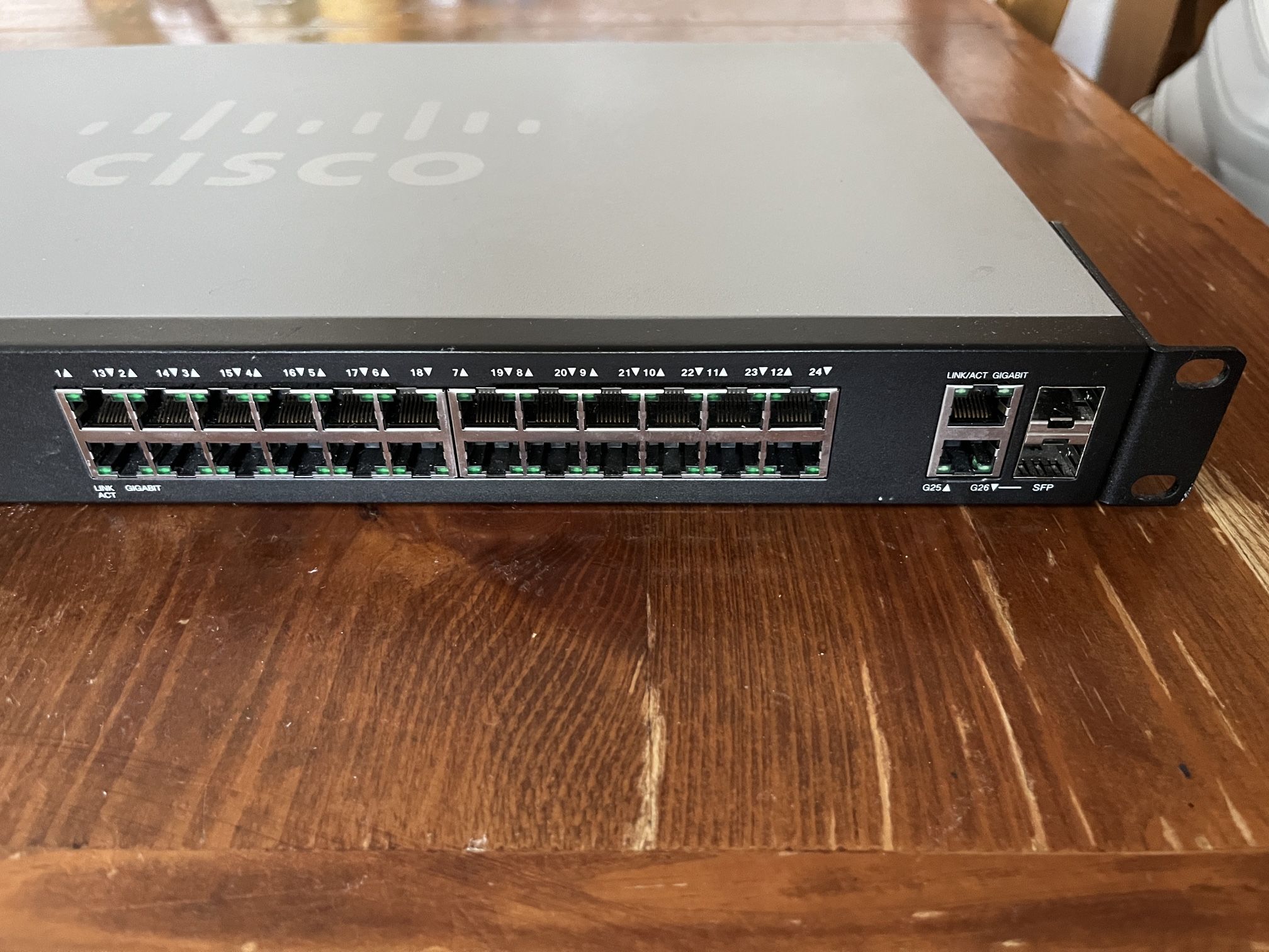 CISCO DESIGNED SG200 26 Gigabit Ethernet Smart Switch with 24 10/100/1000 Ports and 2 Combo Mini GBIC Ports (SLM2024T NA), one size