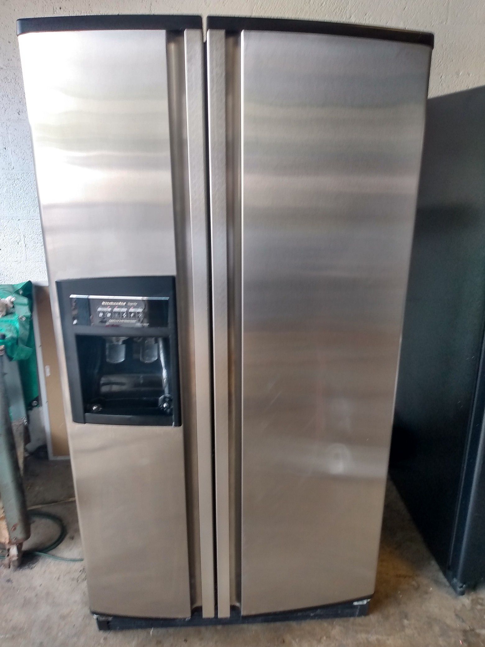 Side-by-side stainless steel refrigerator