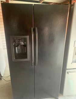 Black GE Refrigerator And Freezer