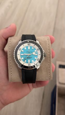 Breitling Superocean Automatic 44 f distinctive turquoise blue dial and a black rubber strap