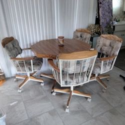 Dining Table And Four Rolling Chairs