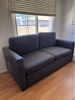 Blue couch bed sleeping