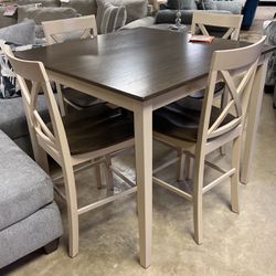 Brand new table and four stools for 399