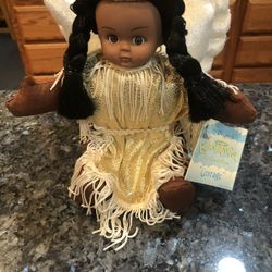 DollThe Original Bean Angel Collectibles Native American Stuffed Doll “Courage”.  With gold fringe dress.  Size 9 inches tall.  Brand New With Tags.  