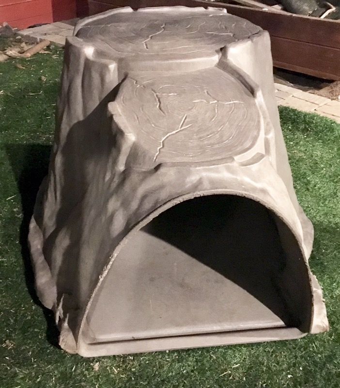 Dog house / igloo shaped like a tree trunk sells new for over $300.