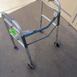 WALKER. HAS EXTRA FOOTS