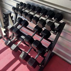 New pair of 5,10,15,20,25,35,45,55lb rubber dumbbells + rack. All new in box $495
