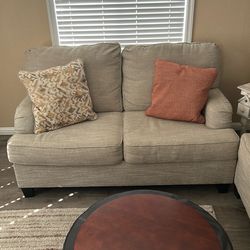 Matching Ashley Furniture couch and loveseat with matching pillows