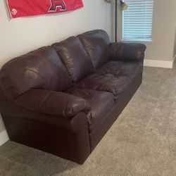 Leather couch with pull out mattress 