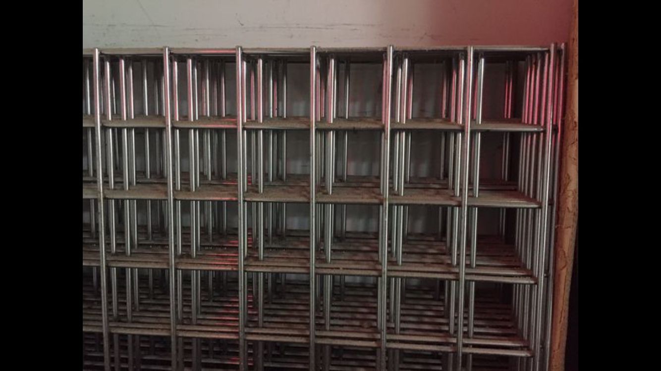 Metal display grids 8 - 24” x 96” , 10 - 24” x 82”, and 12 shelves with brackets