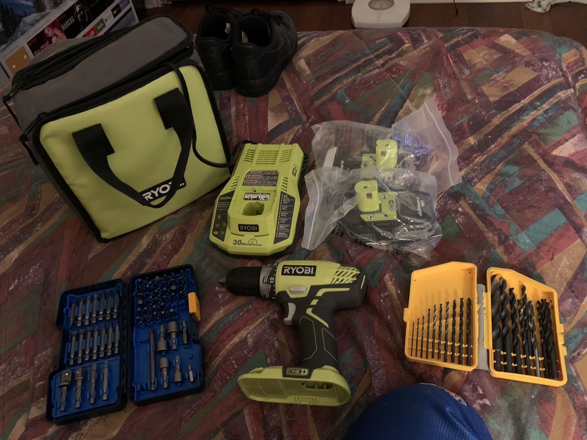 Ryobi drill, bag, two batteries, bit set and charger