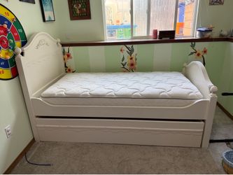 White daybed with trundle and nightstand