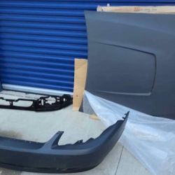 OEM Ford Mustang Hood + Front Bumper Cover + Grille (1999–2004)