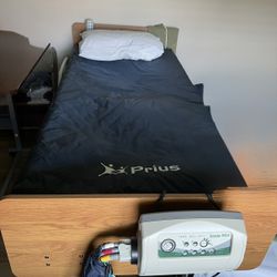 Electric Adjustable Bed With Alternating Pressure Prius Mattress And Adjustable Over Bed Table