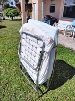 Folding Metal Frame Bed With Mattress And Wheels. Good Condition