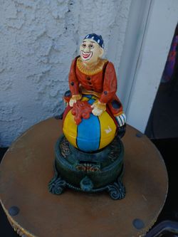Vtg Cast Iron Spinning Clown on Globe Mechanical Coin