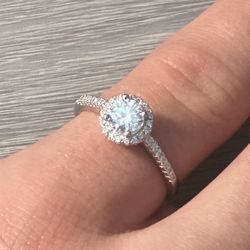 Beautiful round brilliant moissanite ring with halo setting. Comes with GRA certificate.
