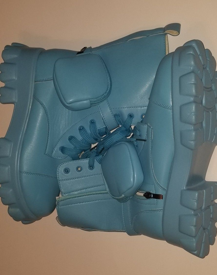 Brand new Boots with extra mini pouches.