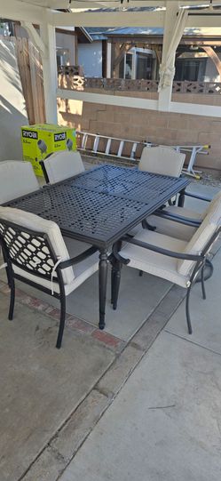 7-Piece Black Steel Outdoor Patio Dining Set with CushionGuard Standard Putty Tan Cushions